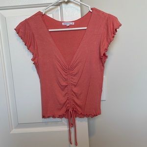 Peach/orange colored v neck crop shirt